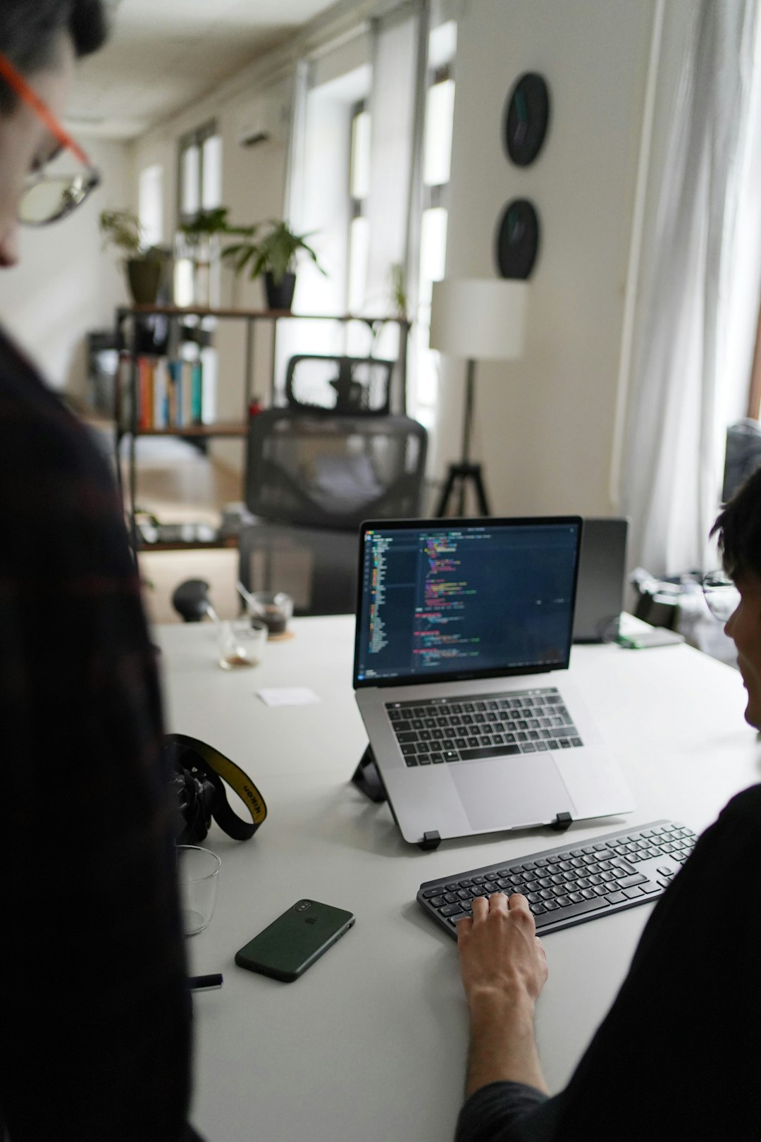 black-and-silver-laptop-computer-on-white-table-nq1q2elpss